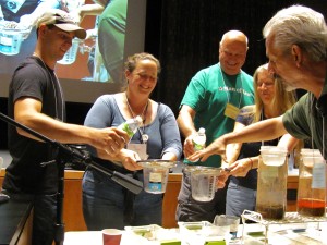 Participants work with Ray on a soil erosion demonstration